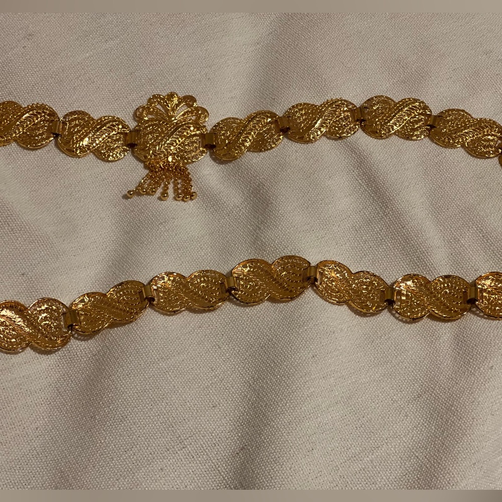 Gold woman’s belt.